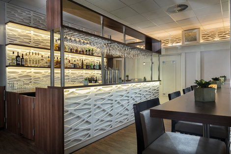 Bar with modern wooden interior in Wyndham Garden Kassel hotel