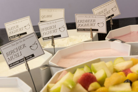 Yoghurt and fruits at the hotel breakfast buffet