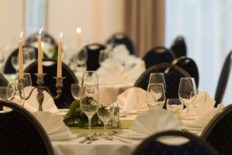 Beautifully decorated dinner tables in banquet room
